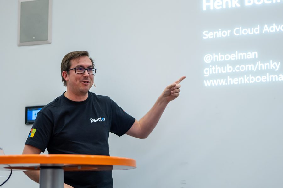 Speaking at a Reactor event, pointing at my own title slide